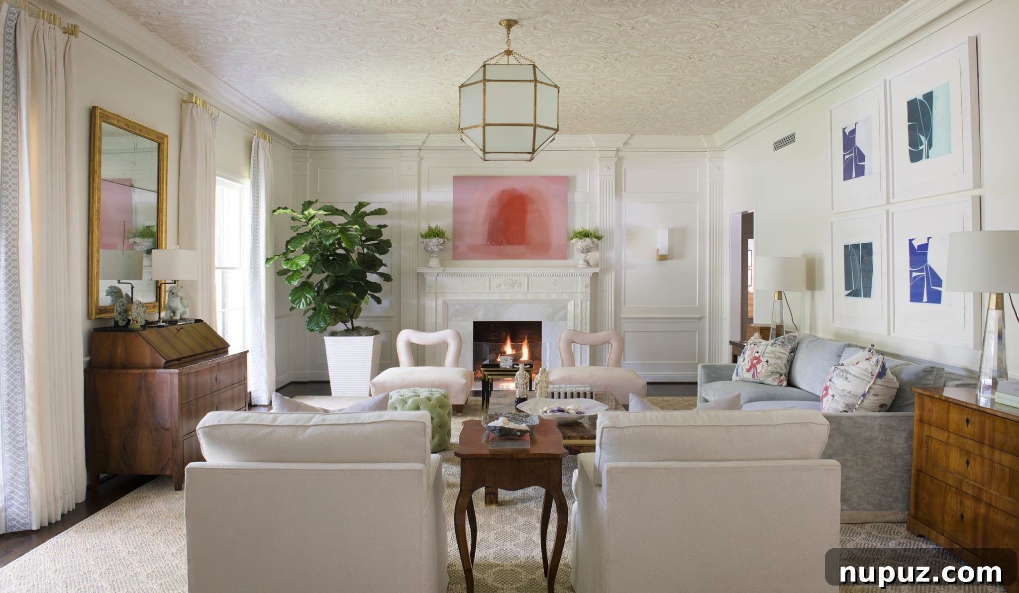A welcoming living space by Jenkins Interiors with plush, deep-seated sofas, abundant natural light flowing through large windows, and tasteful decorative accents, expertly designed for both beauty and everyday functionality. Photographed by Nathan Schroder.