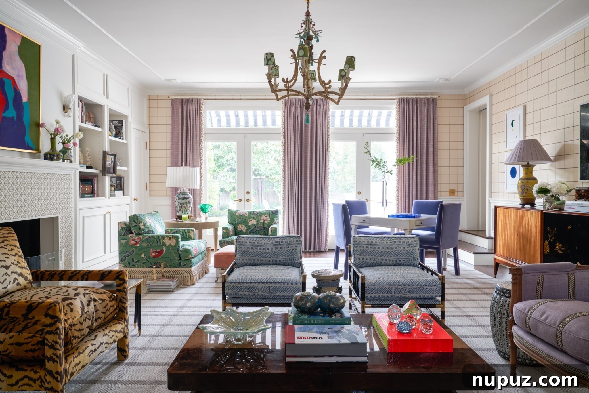 A spacious and elegantly appointed living room by Jenkins Interiors featuring high ceilings, a grand architectural fireplace, and classic furnishings that exude luxury and comfort, creating an inviting atmosphere. Photographed by Nathan Schroder.