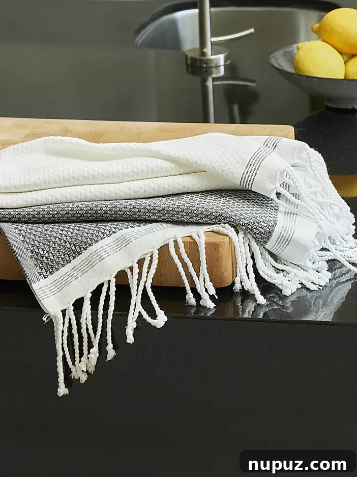 Forever Home: 6 Principles for Lasting Design 4 Luxury blue and white bath towels, showcasing classic patterns and high-quality craftsmanship, perfect for an elegant bathroom in a timeless home.