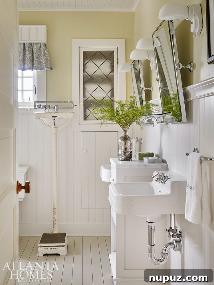Elegance Meets the Water's Edge: A Jackye Lanham Home 16 A charming and cozy porch or outdoor seating area, adorned with soft cushions, potted plants, and an inviting atmosphere for relaxation.