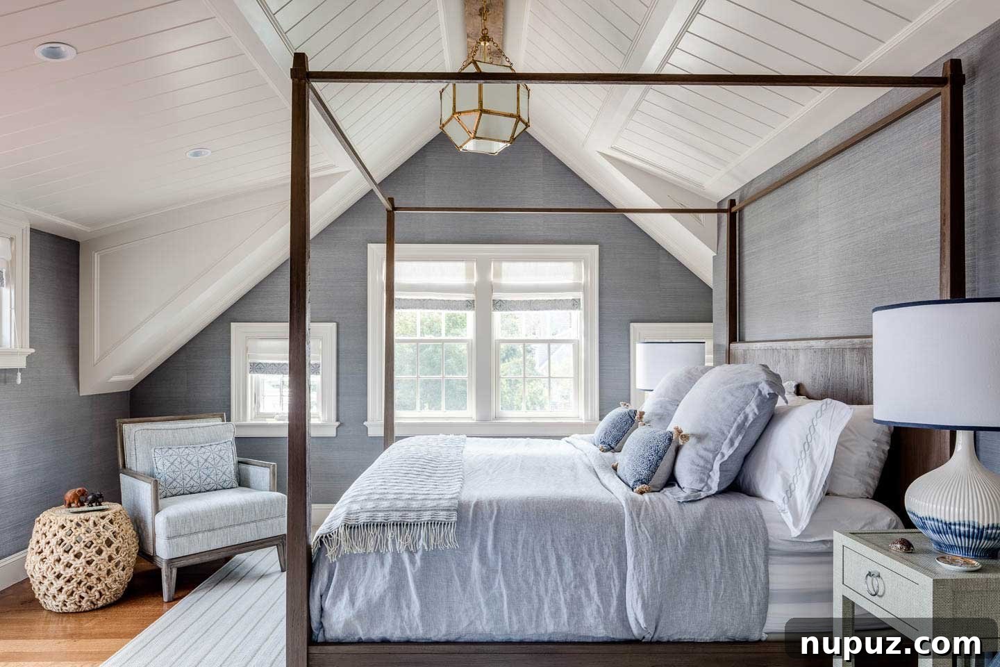 Guest bedroom with blue and white four-poster bed in Chatham beach house