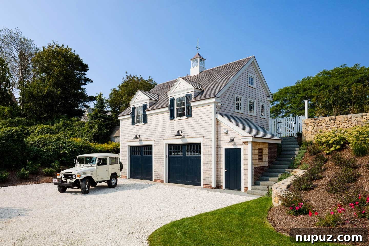 Chatham beach house garage with gray shingles and black doors
