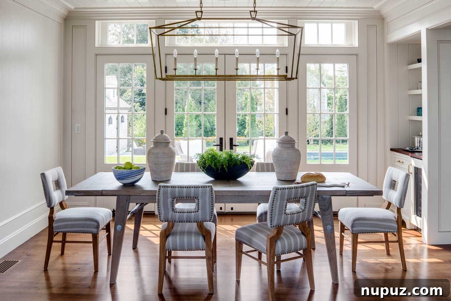 Elegant dining room with linear lighting in a Chatham beach house