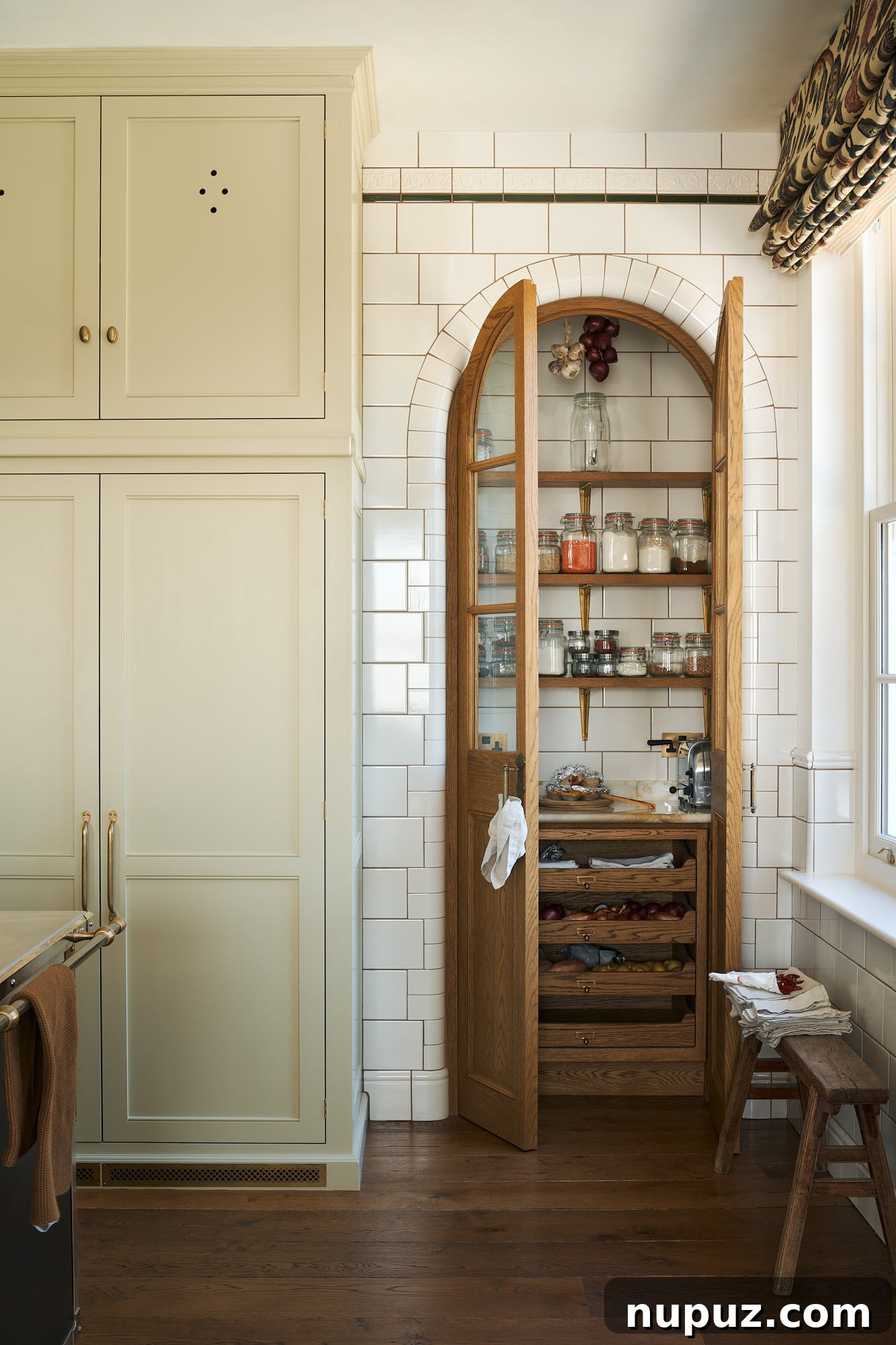 Enduring Kitchen Aesthetics for Your Dream Renovation 5 Curved tiled walls leading to a charming pantry alcove in a deVOL kitchen