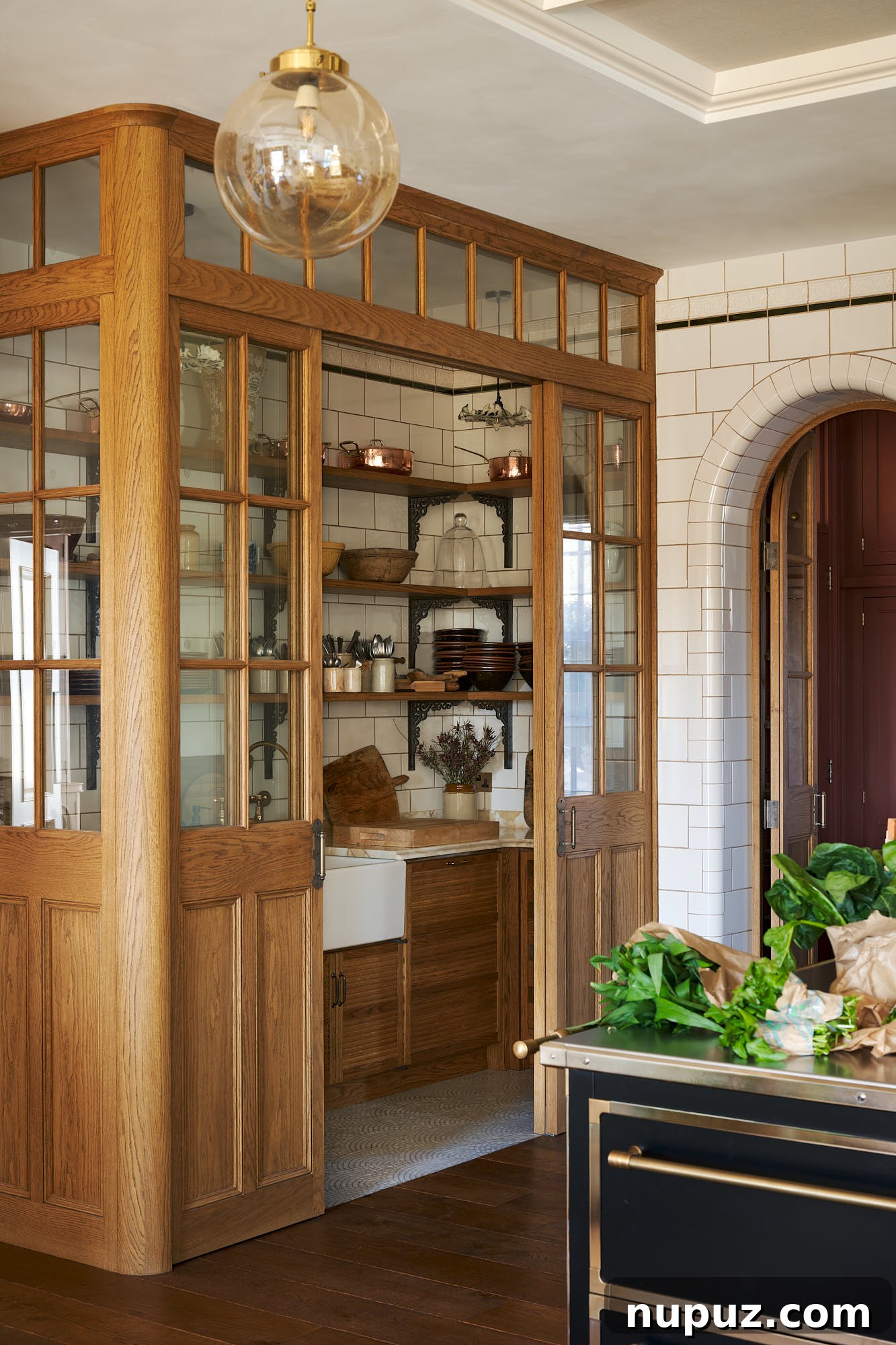 Enduring Kitchen Aesthetics for Your Dream Renovation 7 Elegant butler's pantry or utility room with a coffee bar and brass hanging rail