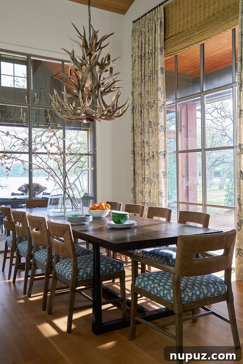 Elegant Dining Room with Striking Antler Chandelier by Nathan Schroder Photography