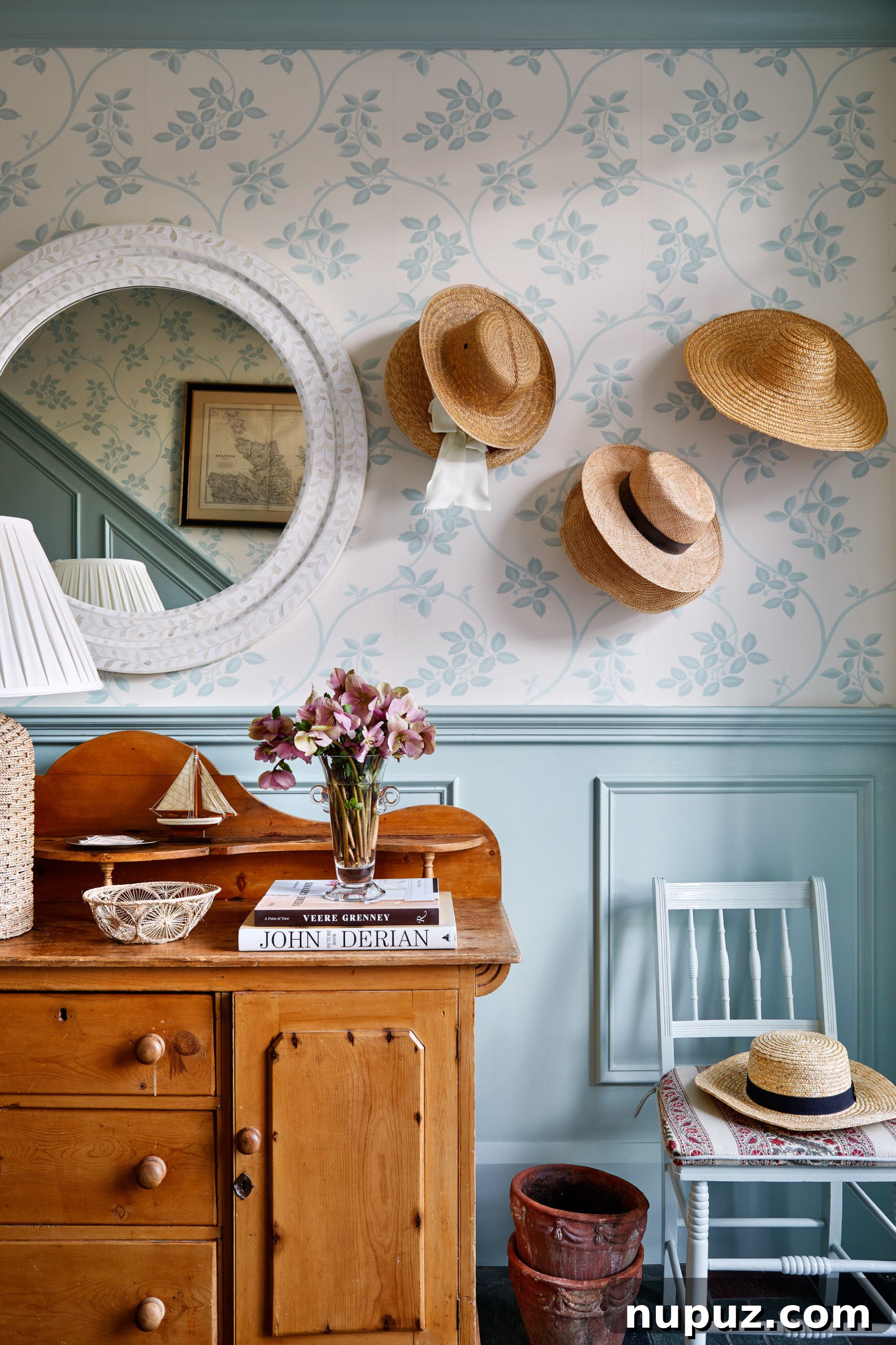 Blue and white wallpaper in the foyer of a New England home. Creating character with elegant design and vintage touches.