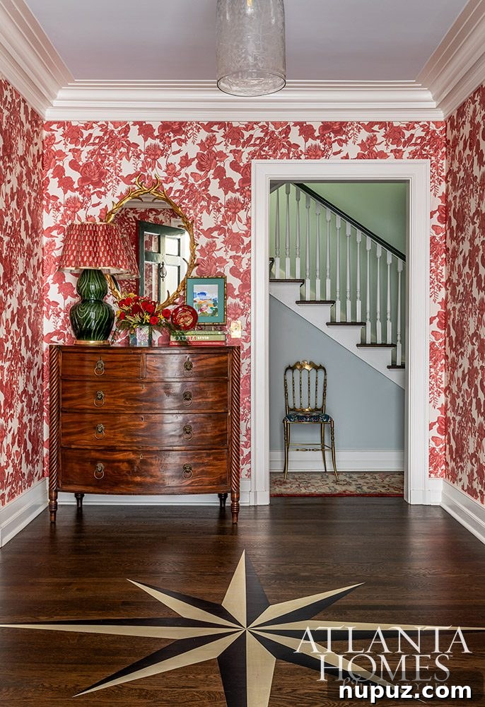 Curating Enchanting Spaces with Whimsy 3 Elegant dining room in an Atlanta home, showcasing a striking chandelier, detailed wall moldings, and classic furnishings by Mallory Mathison.