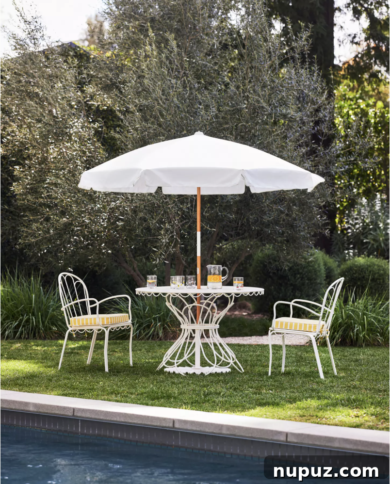 A luxurious outdoor patio designed for ultimate relaxation and sophisticated entertaining, featuring comfortable seating and lush greenery.