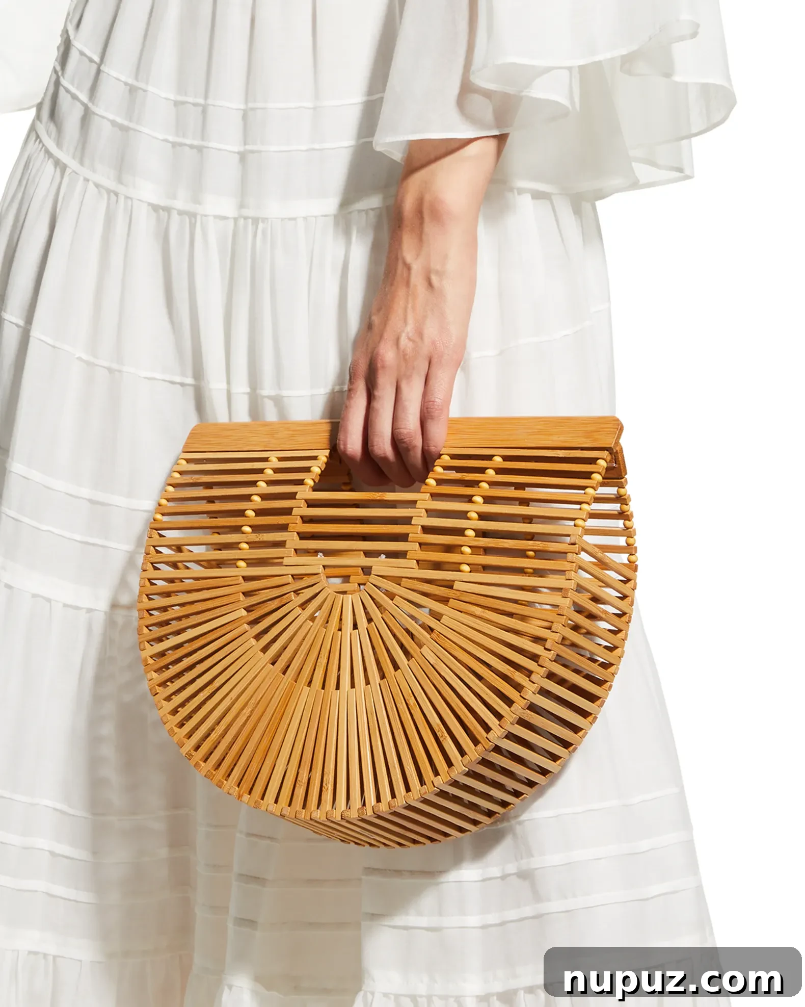 A selection of stylish summer fashion pieces, including Cult Gaia designs, perfect for a chic and effortless warm-weather look.
