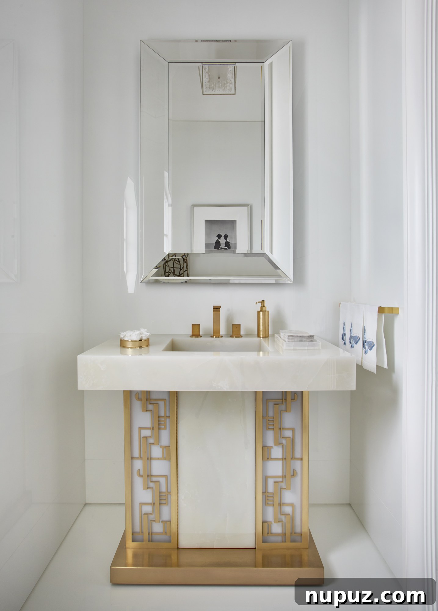 Inside a Palm Beach Home Redefining Modern Elegance 10 Sophisticated bathroom with a pristine white marble sink and custom cabinetry, reflecting the high-end finishes throughout the estate.