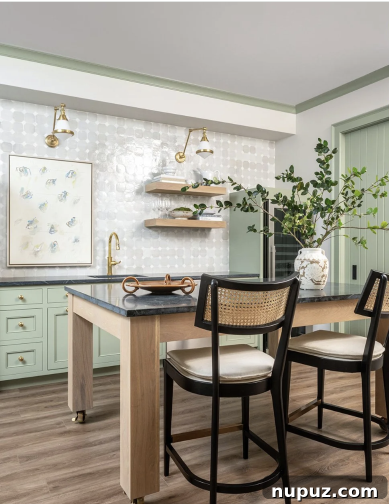 10 Breathtaking Kitchen Makeovers to Inspire You 11 Stunning large kitchen design with elegant pendant lights over a grand island, expansive counter space, and integrated seating, showcasing luxury and practical living.