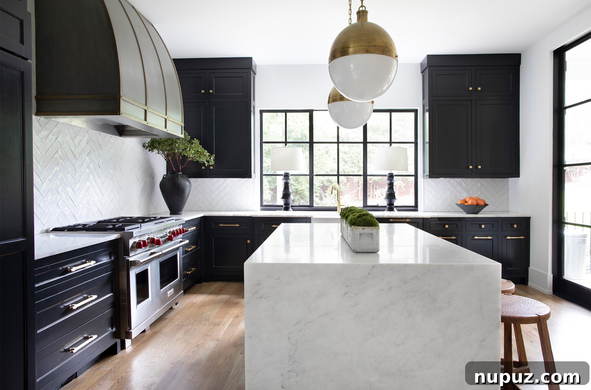 10 Breathtaking Kitchen Makeovers to Inspire You 5 Open concept kitchen featuring an abundance of natural light from large windows, a professional-grade range, and warm hardwood floors, creating an inviting and airy atmosphere.