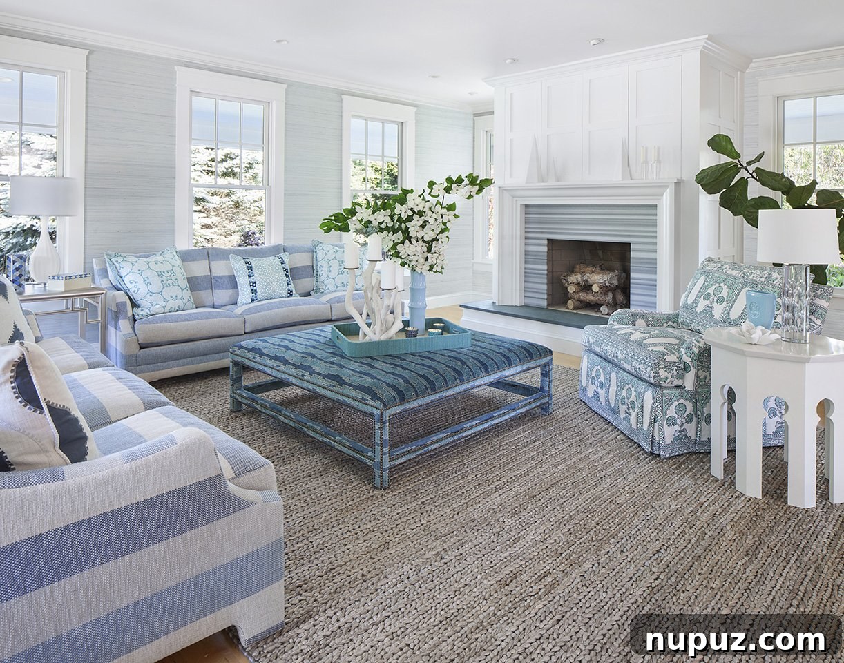 Elegant coastal entryway with a minimalist console table and a serene art piece, reflecting beach house charm