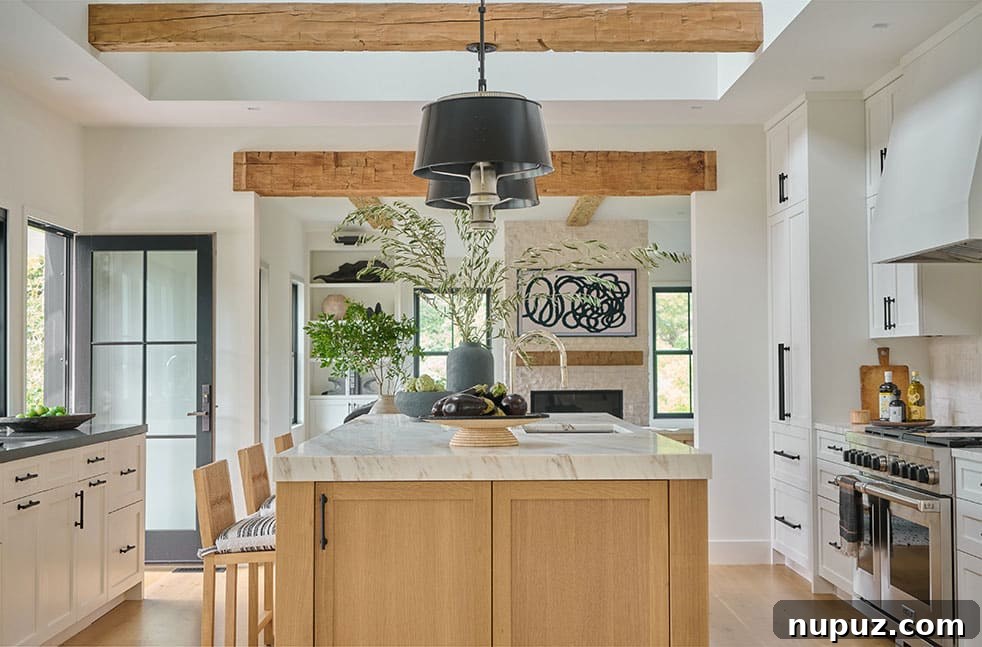 Elegant coastal dining room featuring a long wooden table, classic spindle-back chairs, and subtle lighting, creating a perfect setting for gatherings.