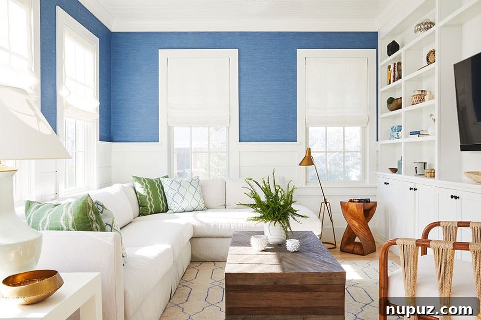 Comfortable and stylish blue and white living room featuring a spacious sectional sofa by Nina Liddle Design, photographed by Matt Kisiday Photography.