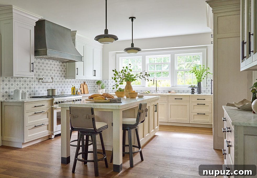 Crafting Coastal Elegance in a Nantucket Abode 8 Luxurious bathroom with elegant tiling and modern fixtures in a Nina Liddle designed Nantucket home
