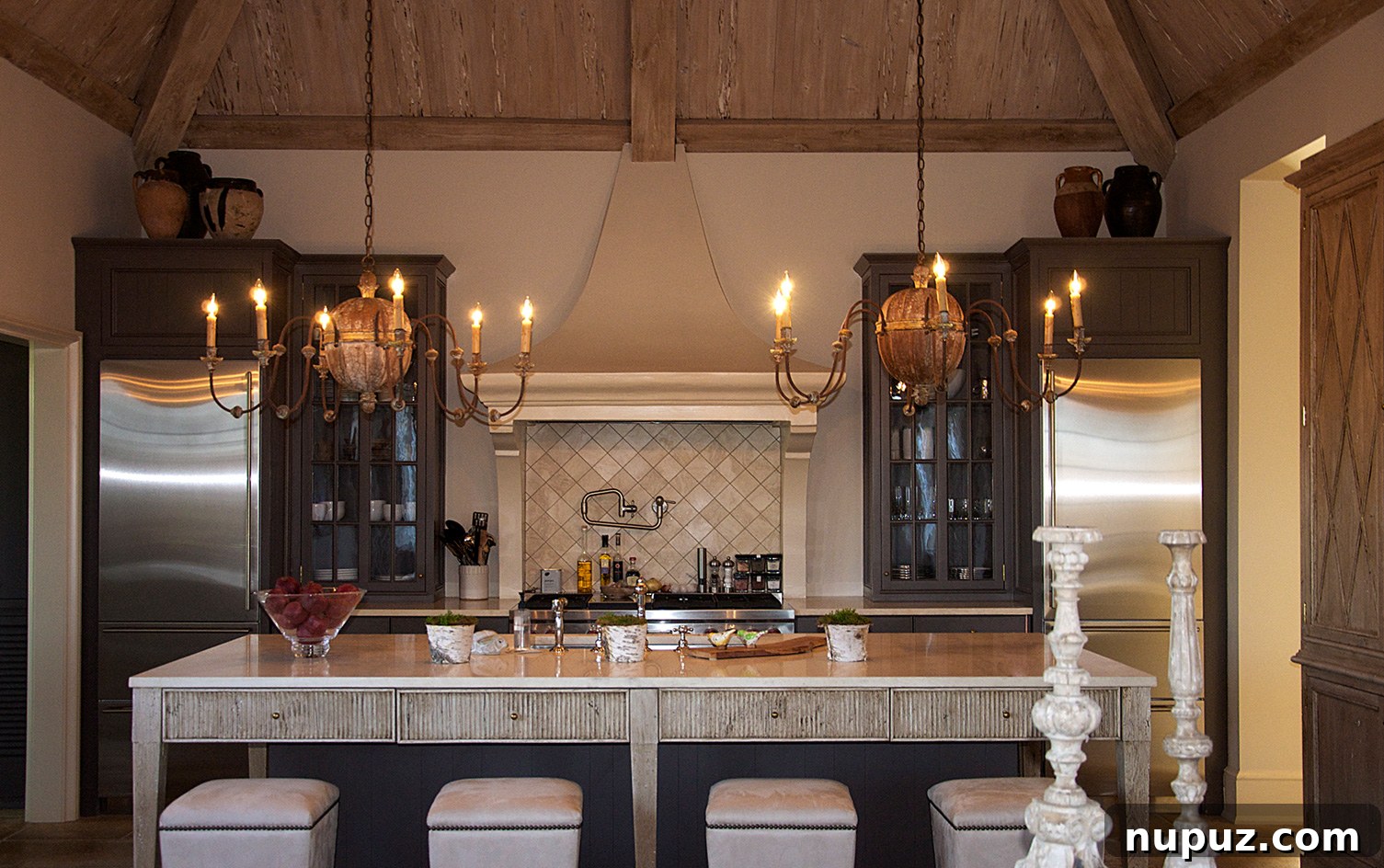 Bright kitchen featuring blonde wood cabinetry and elegant honed marble countertops, designed by Paul Bates Architecture and Liz Hand Woods Interiors.