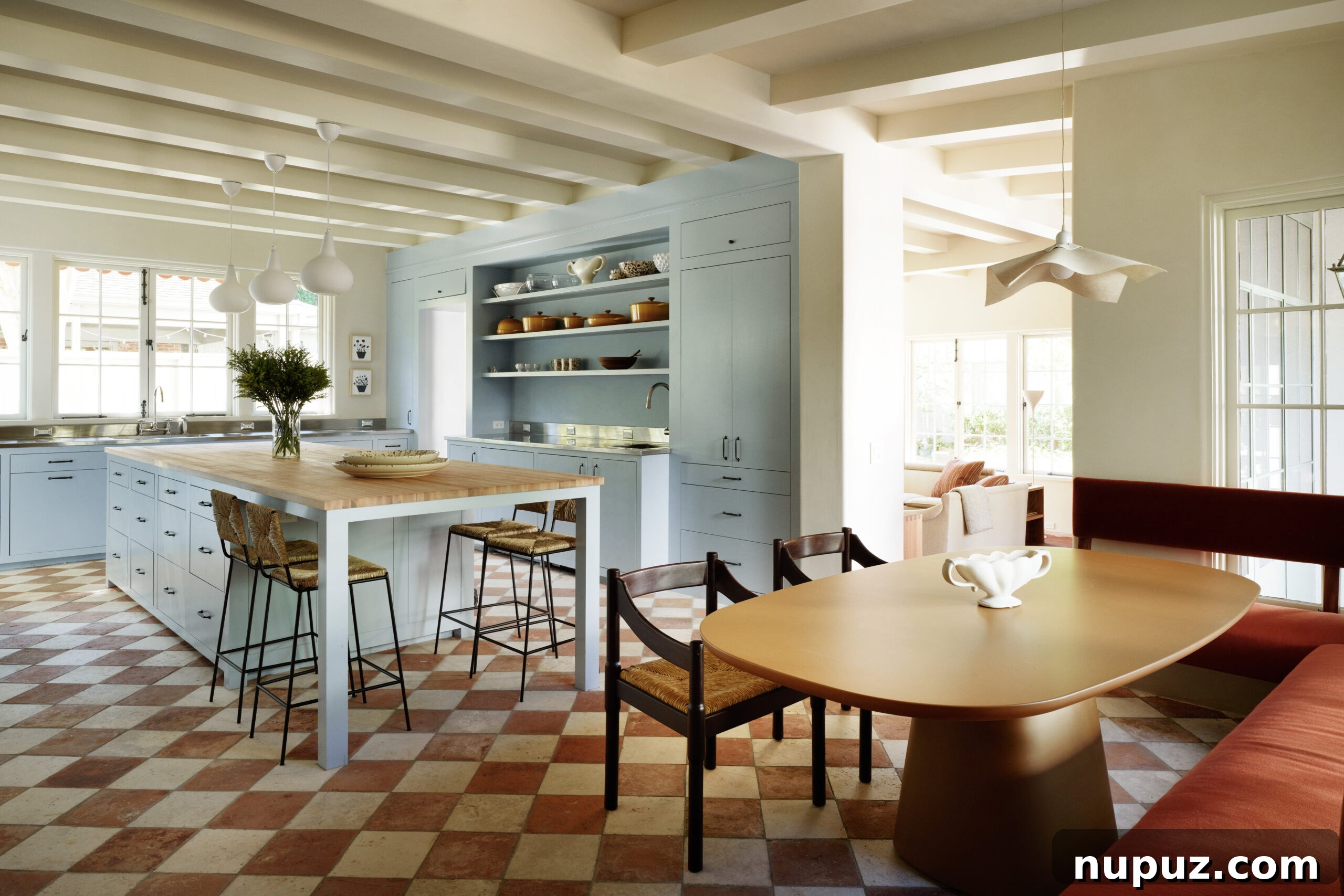 Elegance Redefined: Fusing Modern and Traditional Interior Styles 4 A luxurious traditional kitchen featuring rich wood beams and a classic checkerboard floor, highlighting Curtis and Windham's signature blend of rustic charm and refined elegance.