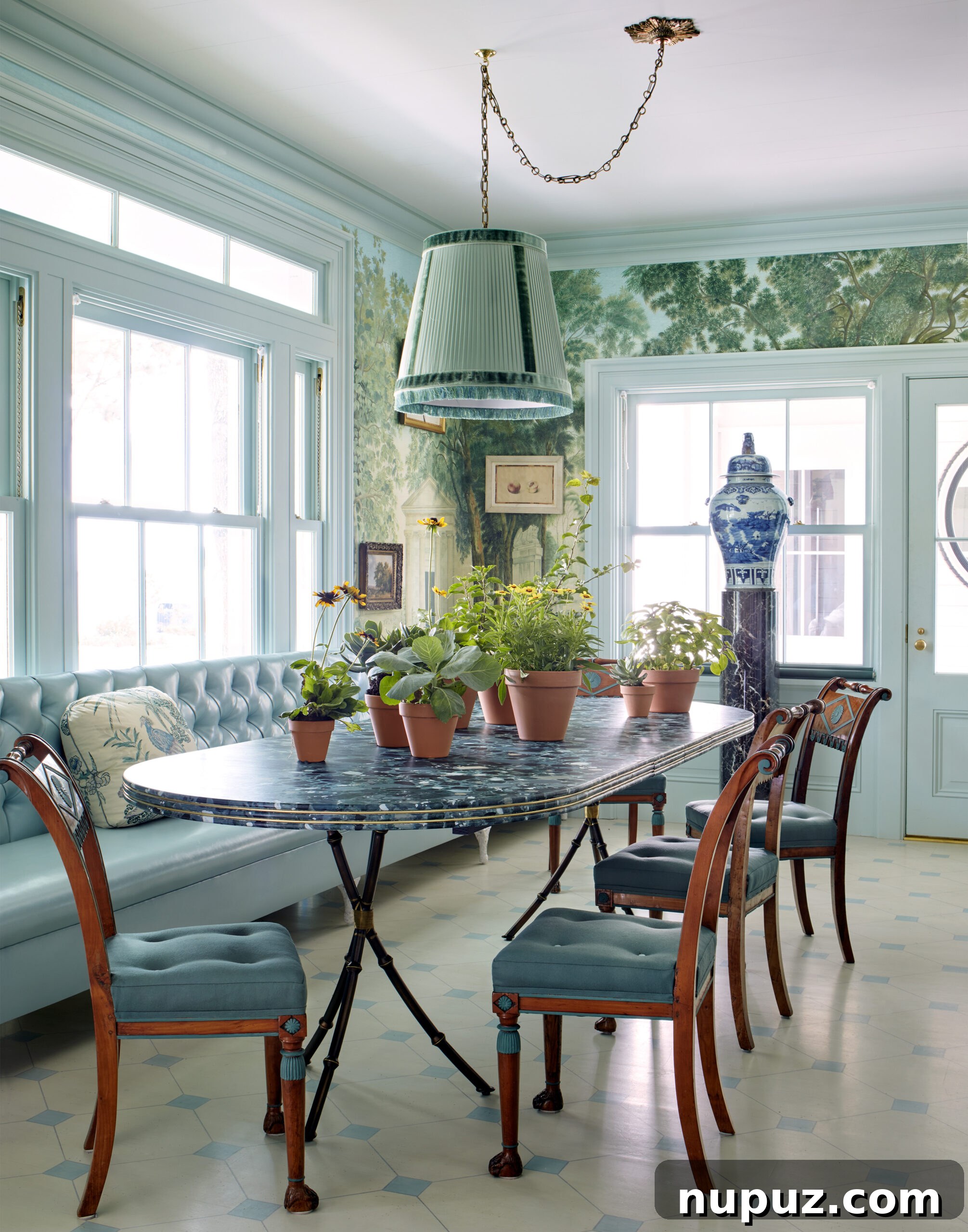 Elegance Redefined: Fusing Modern and Traditional Interior Styles 5 An inviting dining nook featuring a tufted leather banquette and elegant wallpaper, showcasing traditional interior design with luxurious and comfortable elements.