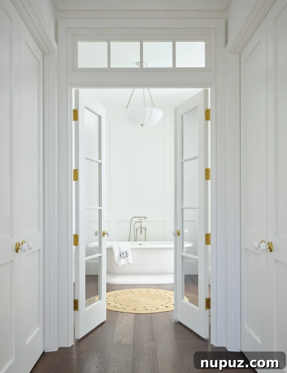 Kara Miller's Farmhouse Retreat 13 Another elegant bathroom featuring a spacious walk-in shower with beautifully tiled walls and contemporary fixtures, designed with comfort and luxury in mind by Kara Miller. Photography by Brantley Photography.