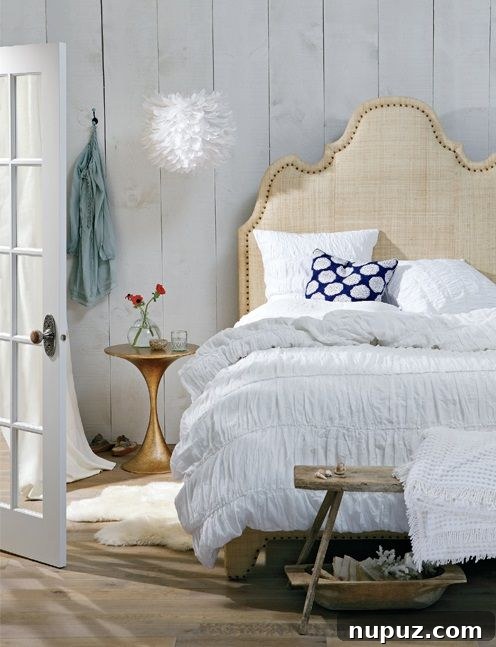 A favorite upholstered headboard design from Gorgeous Living, providing a luxurious and stylish focal point in a serene bedroom interior, enhancing both comfort and aesthetic appeal.