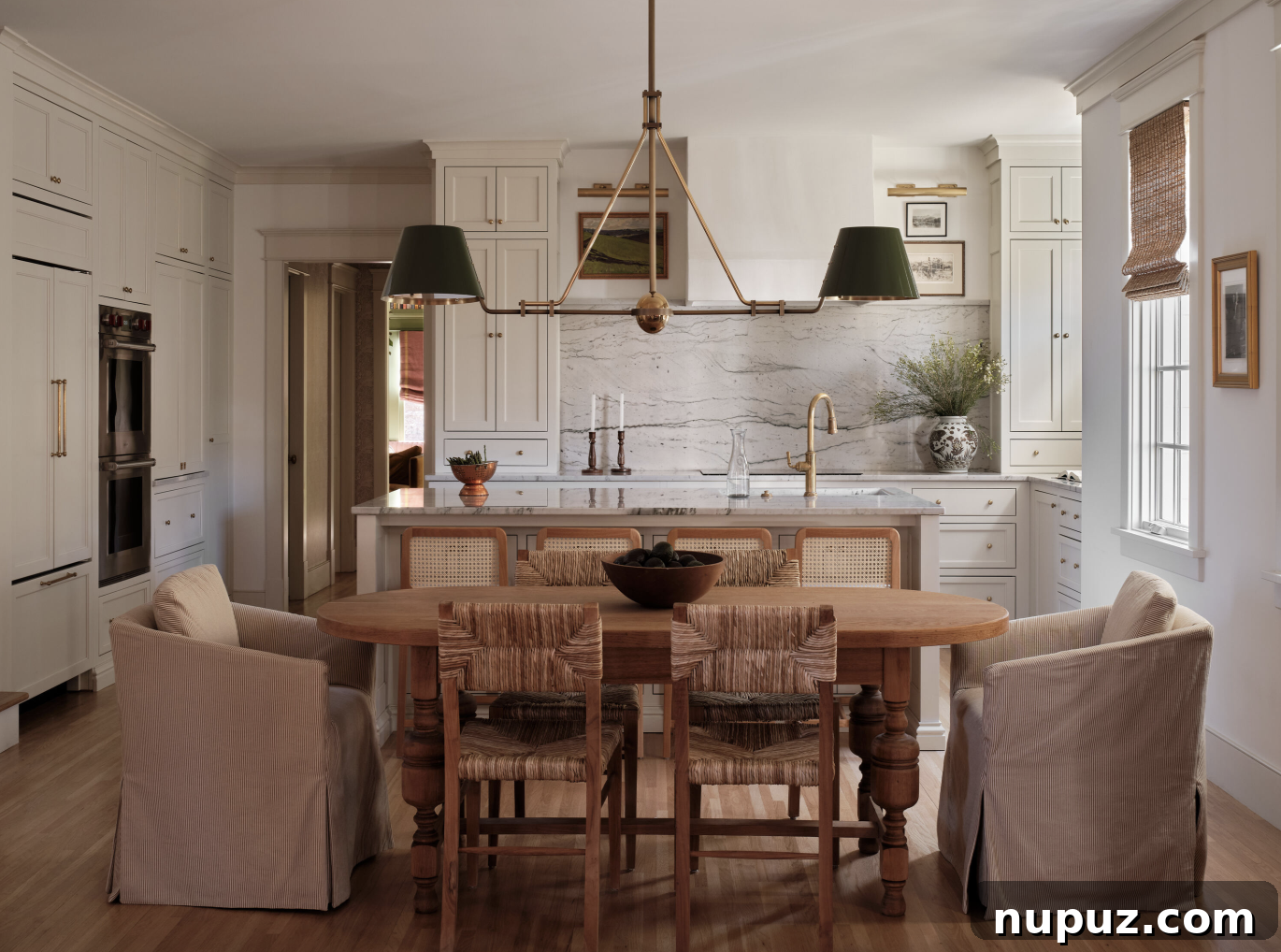 Layering for Impact: Interior Design with Stephanie Sabbe 5 A sophisticated kitchen and adjacent eat-in dining room by Stephanie Sabbe, exemplifying functional elegance, captured by Joseph Bradshaw Photography.