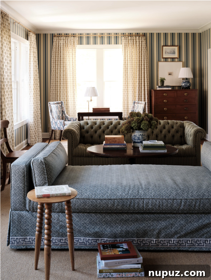 Sophisticated living room in a Stephanie Sabbe-designed home, featuring a deep blue tufted sofa, rich wood accents, and abundant natural light, highlighting her signature 'livable elegance' aesthetic.