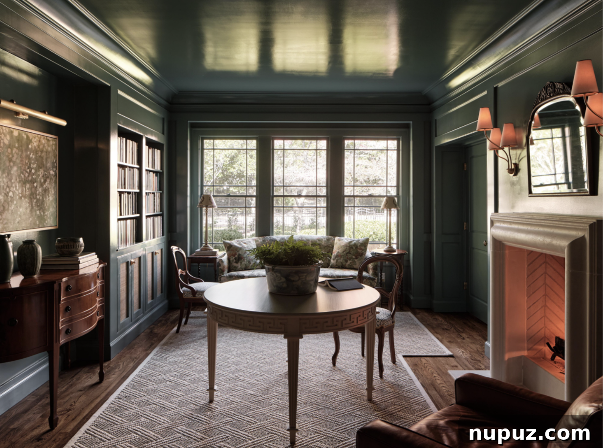 Cozy and refined living space by Stephanie Sabbe, centered around a classic fireplace with comfortable leather armchairs and a stylish round coffee table, perfect for intimate gatherings.