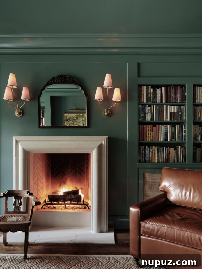 Spacious and inviting living room designed by Stephanie Sabbe, showcasing a thoughtful arrangement of classic and contemporary furnishings, a large fireplace, and expansive windows offering views of the Catskills.