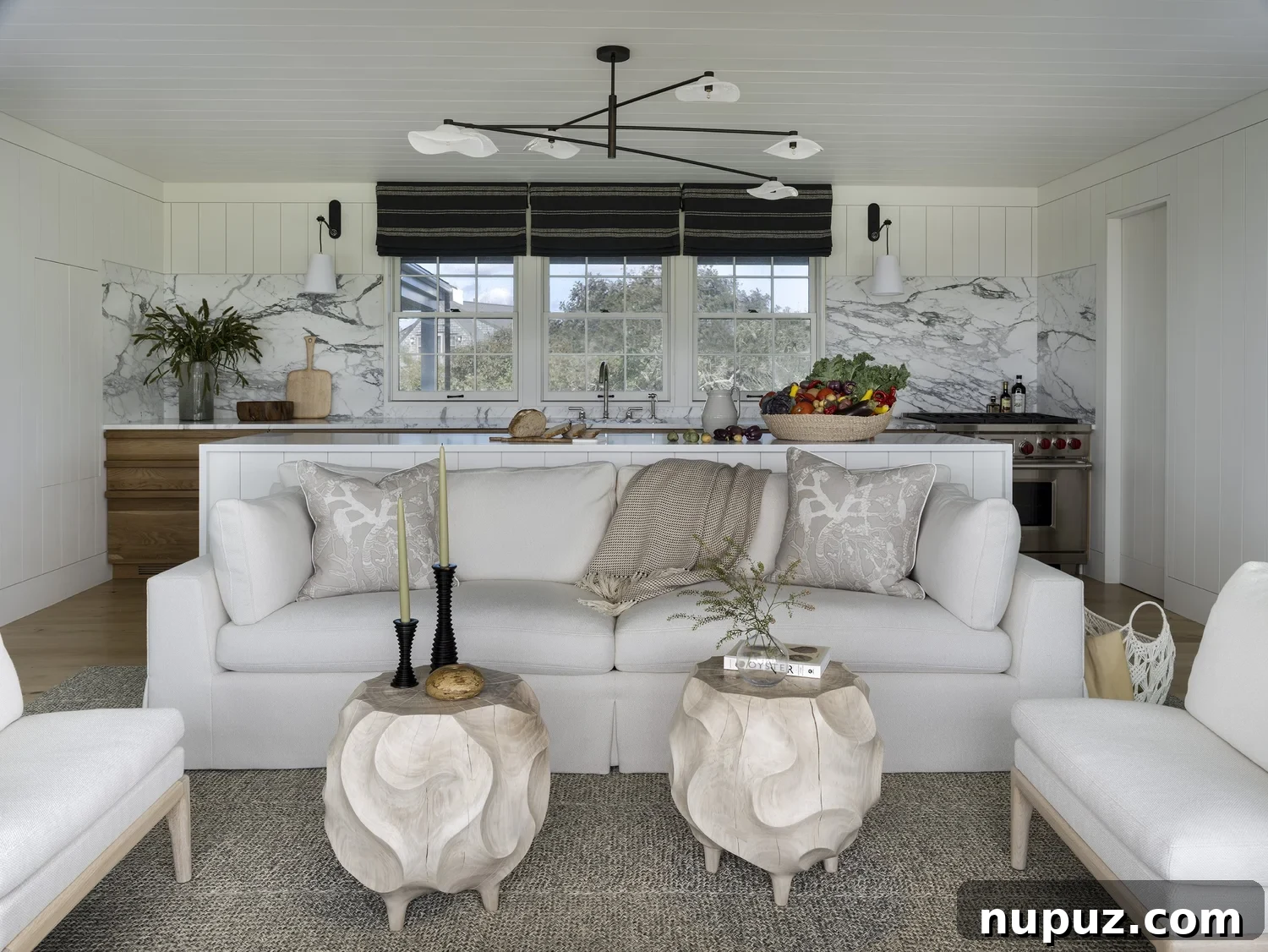 Nantucket's Timeless Coastal Sanctuary Unveiled 2 Nantucket coastal living room with white slipcovered sofas, open-concept layout, and natural textures designed by Honey Collins Interiors