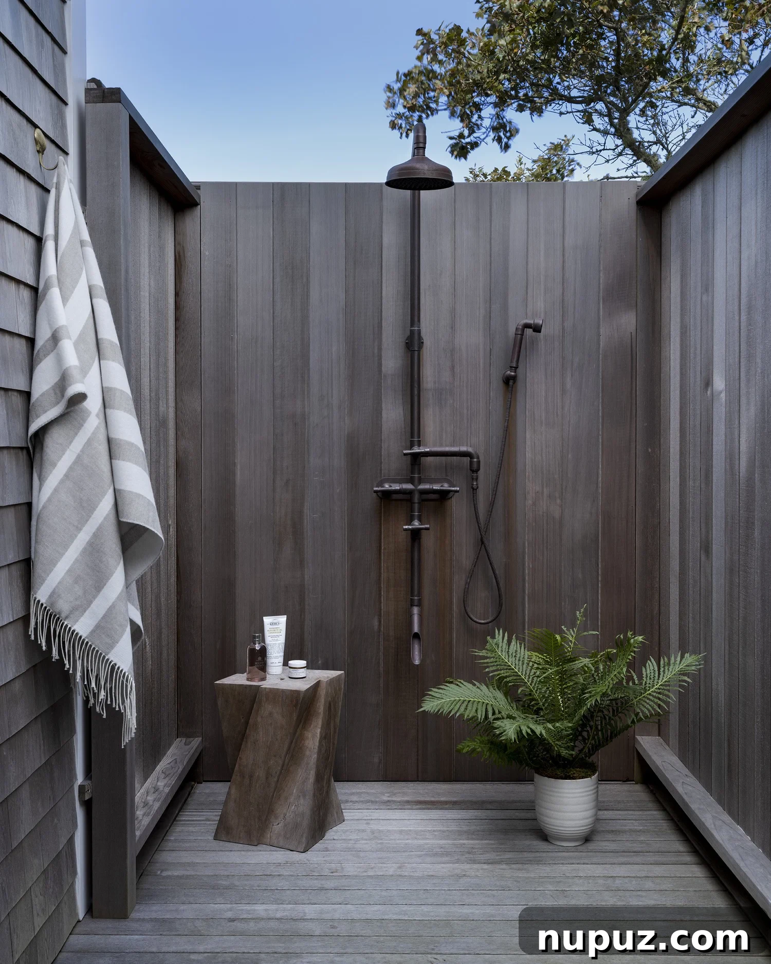Nantucket's Timeless Coastal Sanctuary Unveiled 11 Refreshing outdoor shower, a quintessential Nantucket amenity for coastal living and post-beach rinse-offs