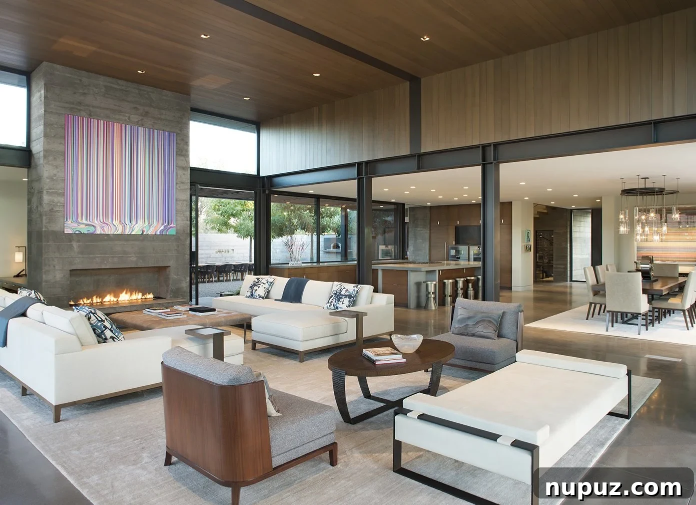 Warm and inviting living room with a stone fireplace and comfortable armchairs, showcasing Honey Collins's design warmth.