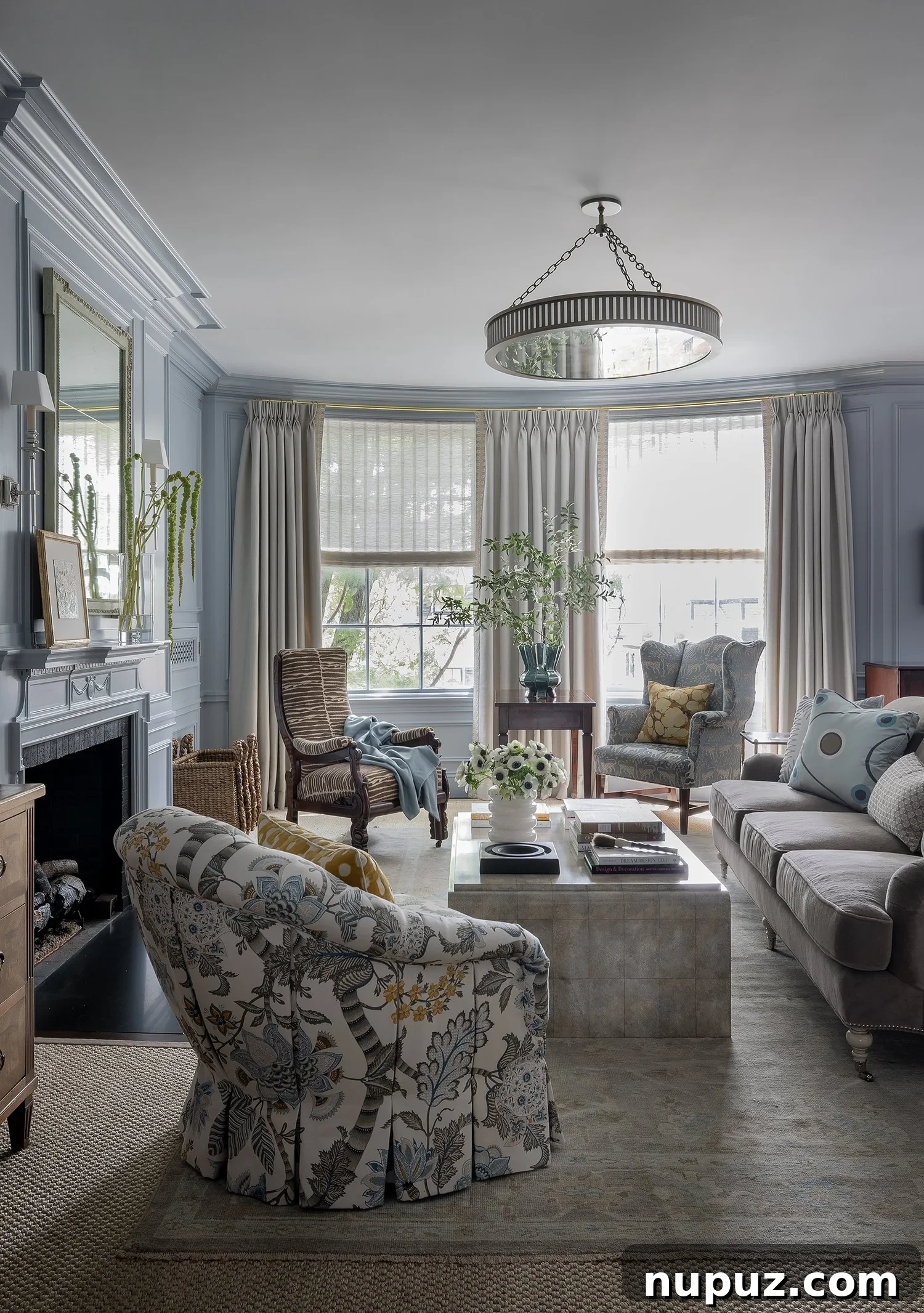 Sophisticated living room with dark wood accents and plush seating, designed for comfort and style by Honey Collins Interiors.