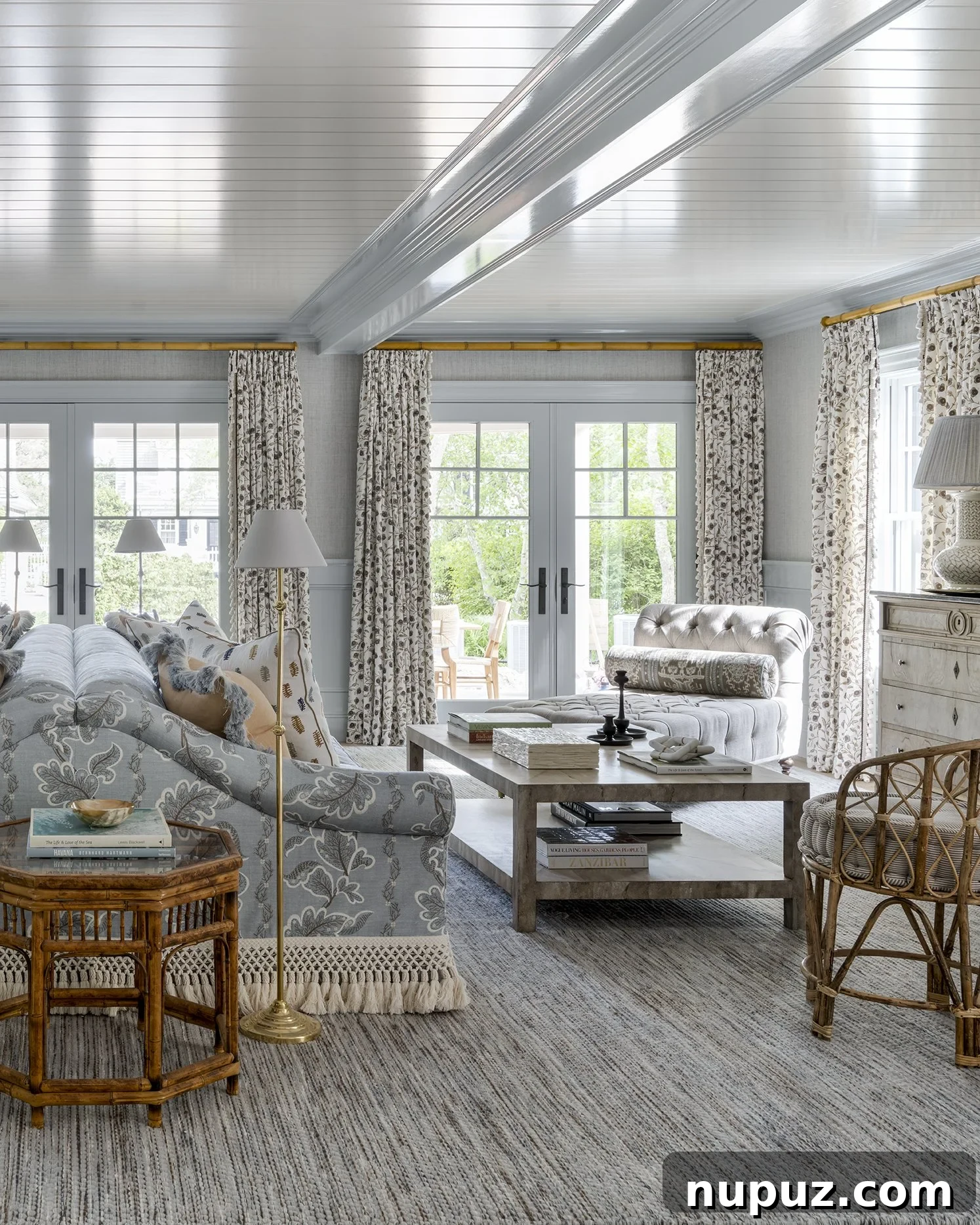 Elegant living area with a large sectional sofa and statement lighting, showcasing Honey Collins's interior design expertise.