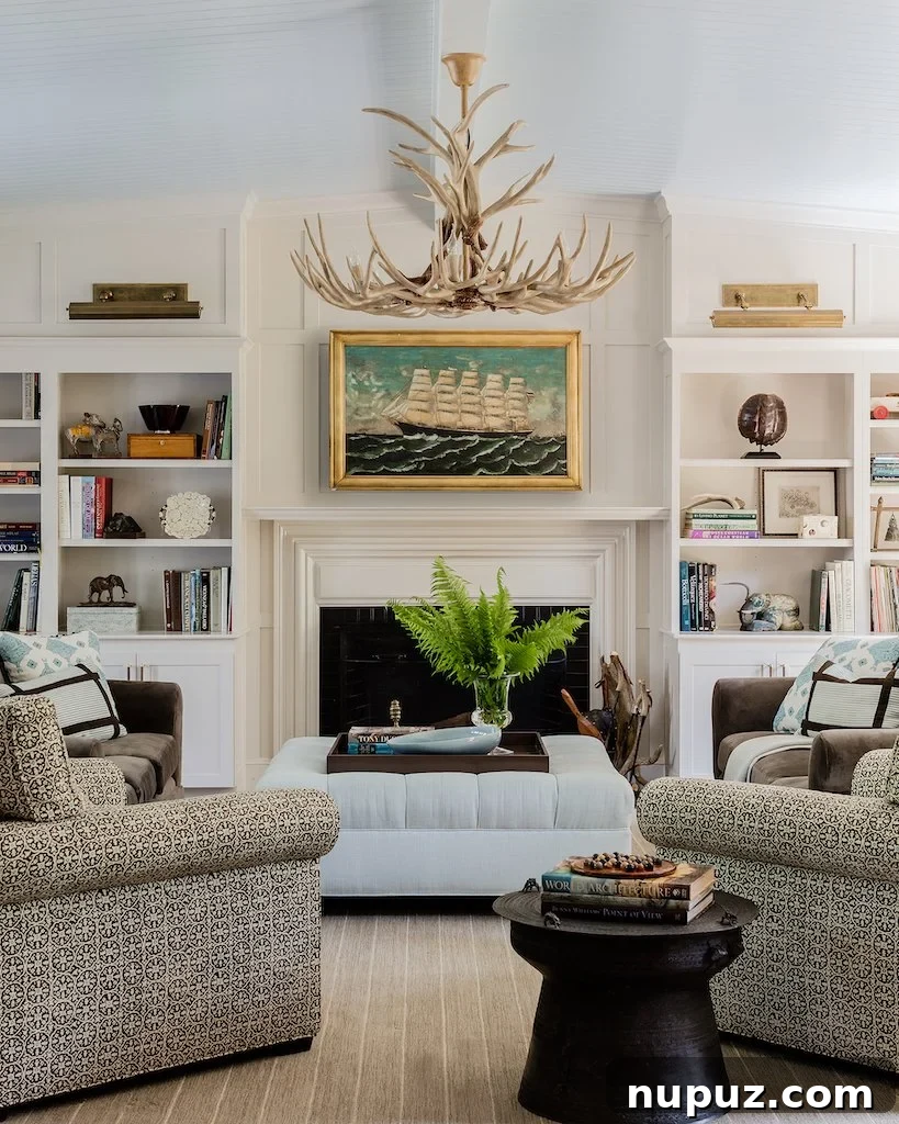 Transitional living room featuring custom built-in shelving and a cozy fireplace, designed by Honey Collins Interiors.