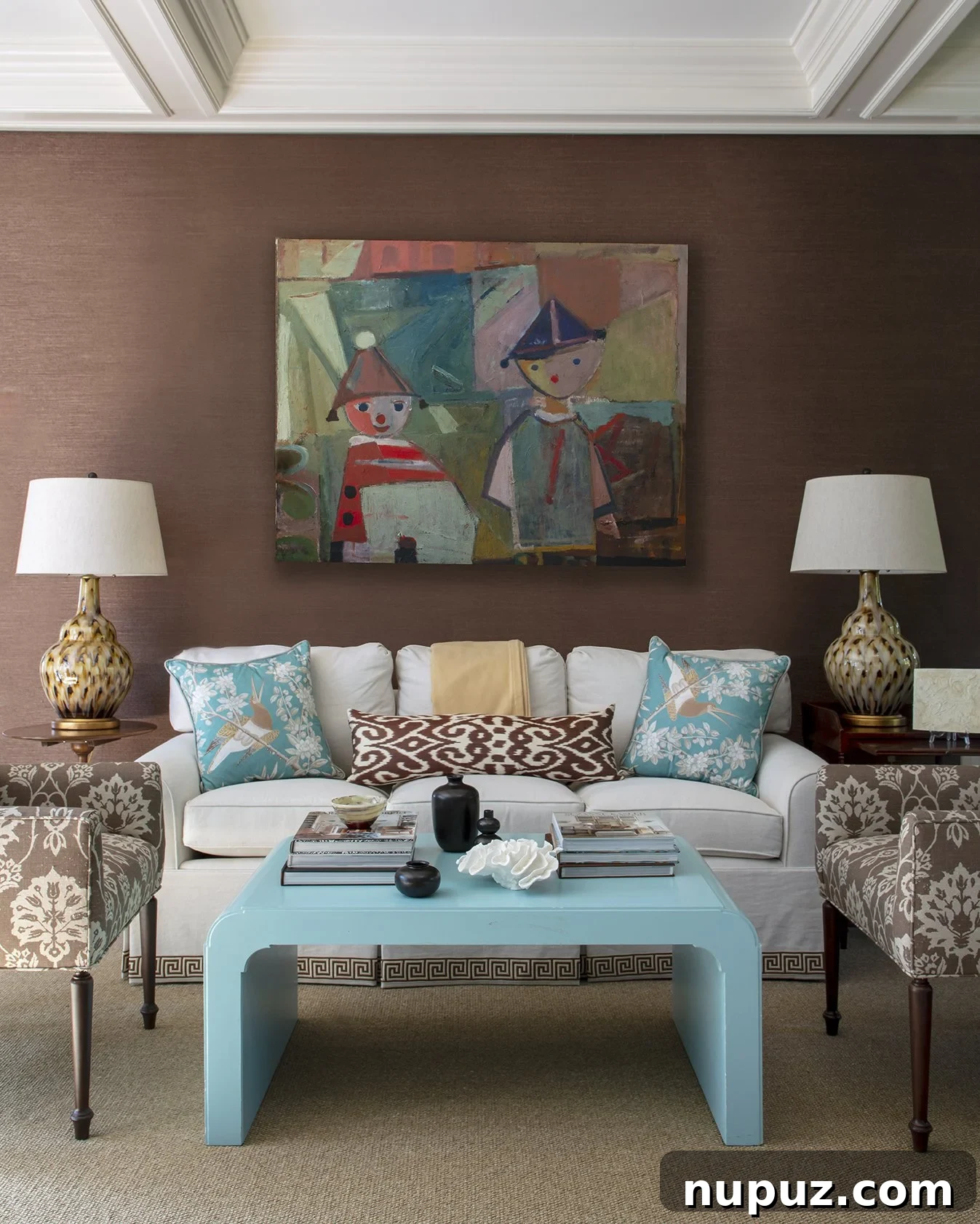 Refined living room with subtle blue and white accents, highlighting a sophisticated design aesthetic by Honey Collins.