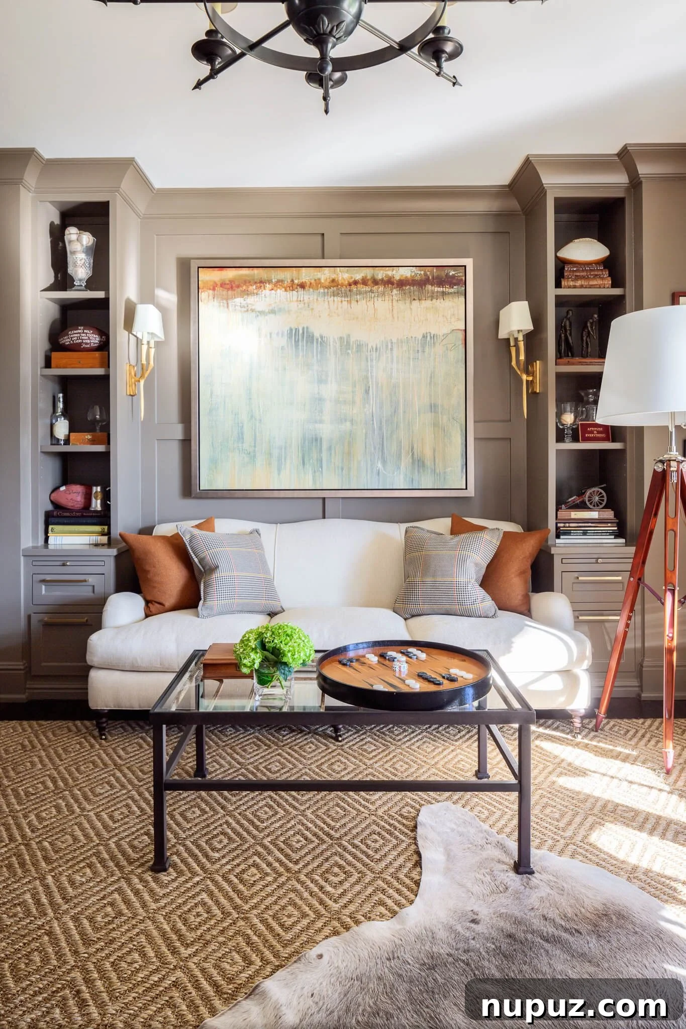Bright and airy coastal living room with white walls, a comfortable sofa, patterned rug, and a large window offering an inviting view.