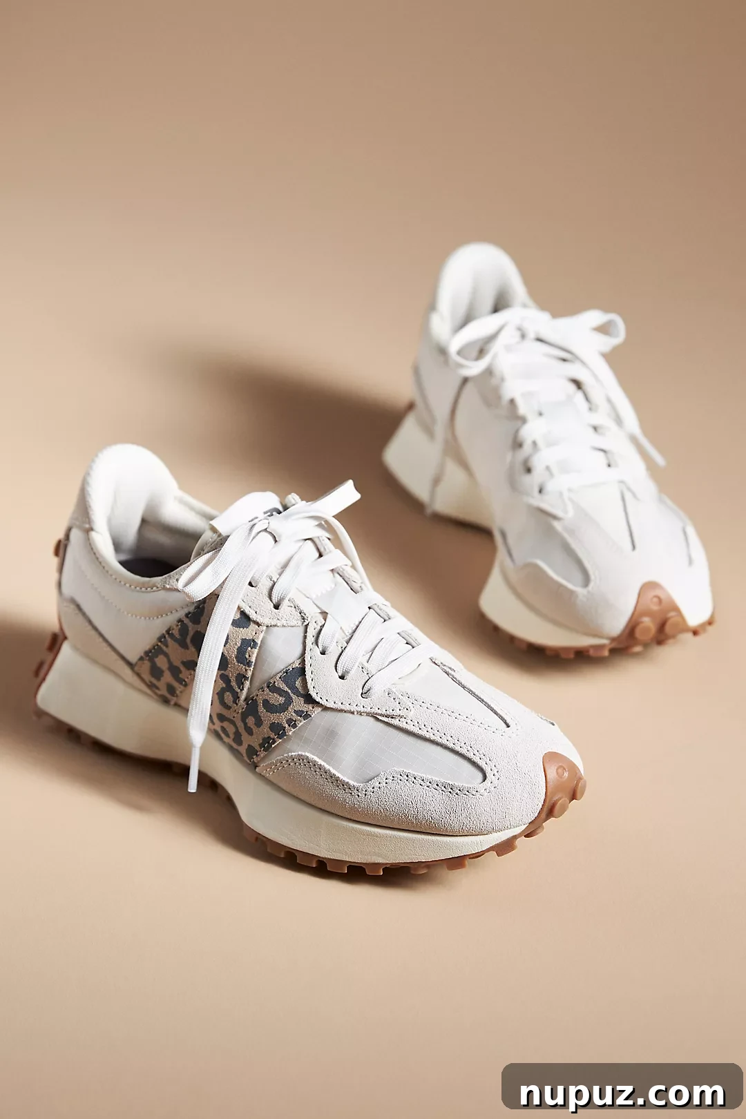 5 Dream Homes: A Masterclass in Style 3 Stylish woman wearing trendy sneakers, showcasing casual chic fashion.