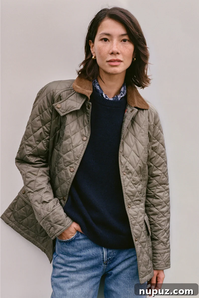 Designers' Own Masterpieces 5 A stylish ensemble of outdoor wear, possibly featuring a waxed cotton jacket and accessories, representing a collaboration between Tuckernuck and Barbour. The items evoke a sense of classic, durable, and sophisticated country style, perfect for outdoor adventures with a touch of elegance.