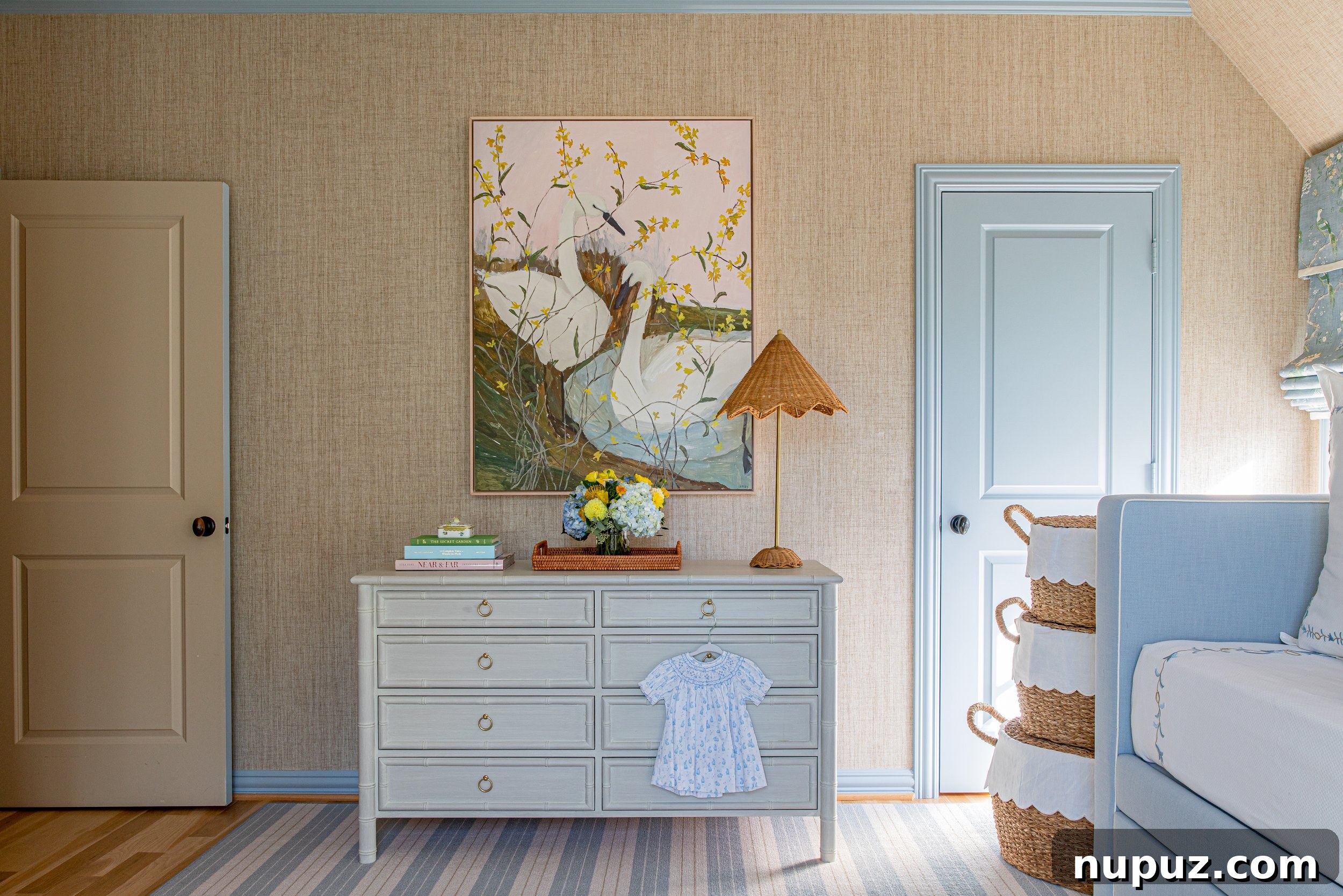 Lindley Arthur's Signature Style: 10 Breathtaking Interiors 10 Lindley Arthur Interiors nursery with charming baskets, delightful swan art, and a serene, child-friendly design.