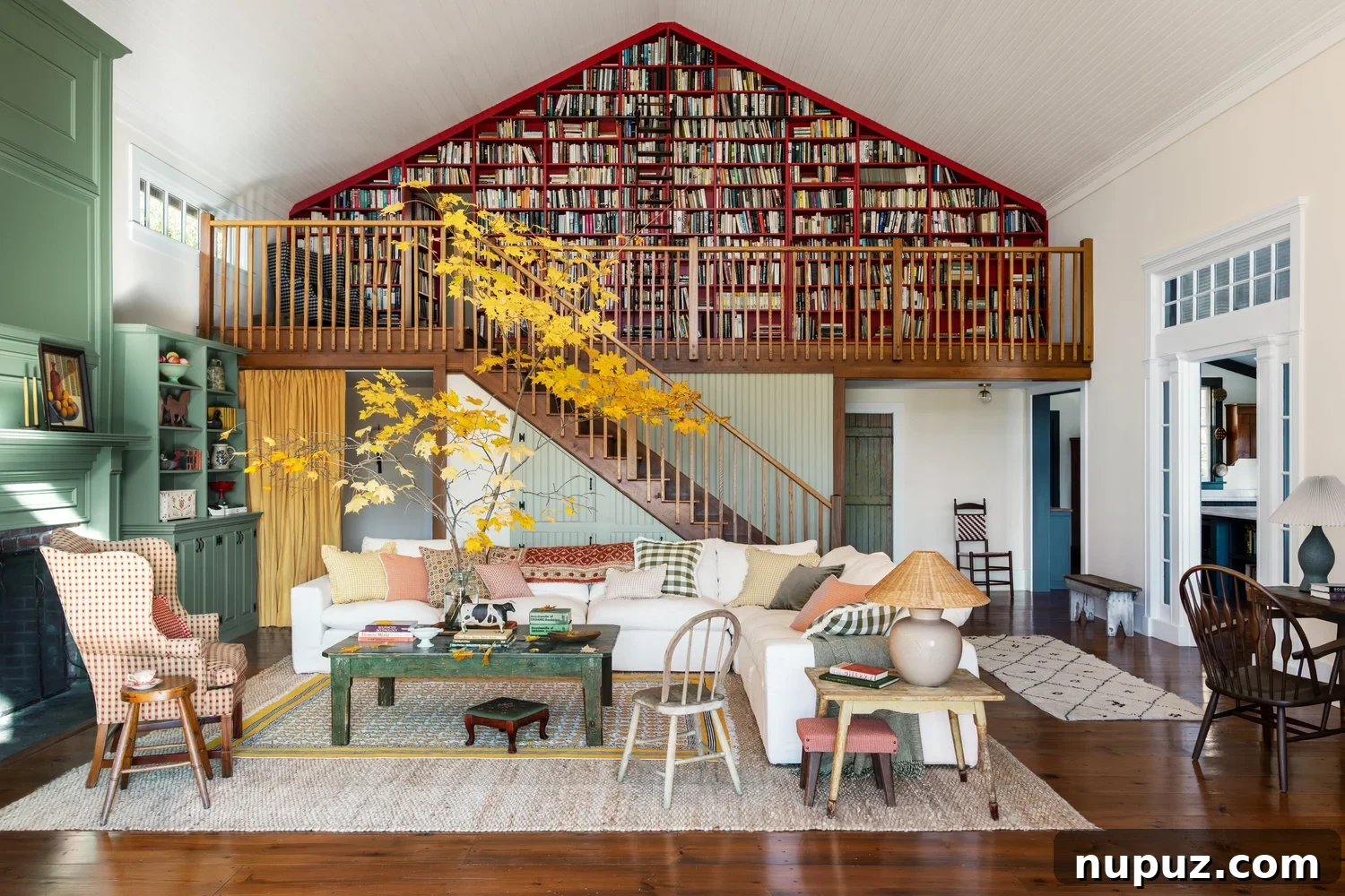 Discover 6 cozy home decor tips to make your home inviting. From simple decor updates to warm lighting ideas, create a space you’ll love! Ariel Okin Interior Design | Julie Leffell Photography - love the wall of books and the fall branches