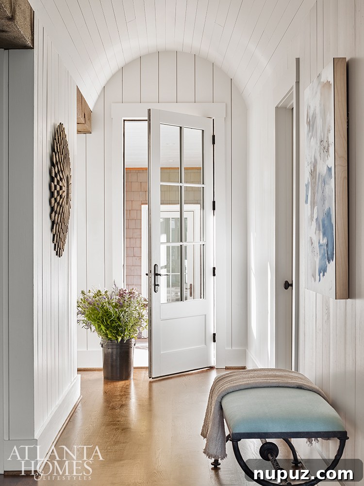 Beyond Beauty: Crafting Homes with Soul and Personality 2 Stunning shiplap entry of a Lake Martin lake house designed by Liz Williams Interiors