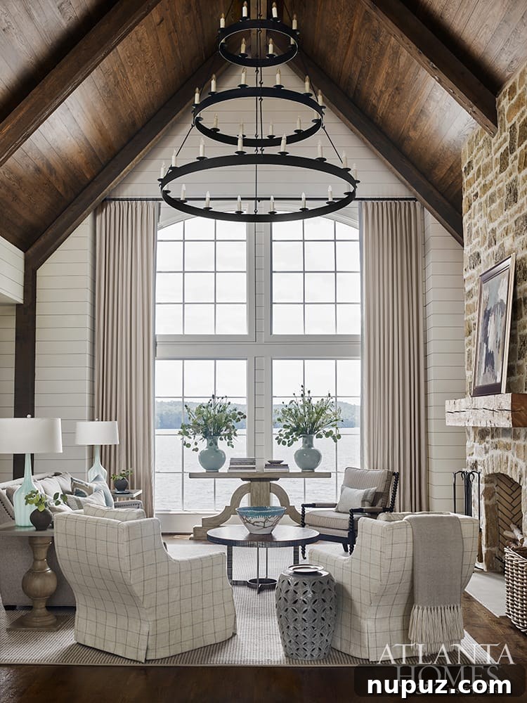 Beyond Beauty: Crafting Homes with Soul and Personality 3 Lake Martin lake house family room by Liz Williams with cathedral ceiling and lake view