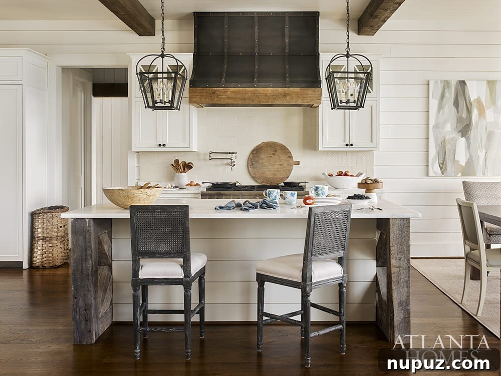 Beyond Beauty: Crafting Homes with Soul and Personality 5 Modern kitchen with stainless steel range hood and warm wood accents in a Liz Williams designed home
