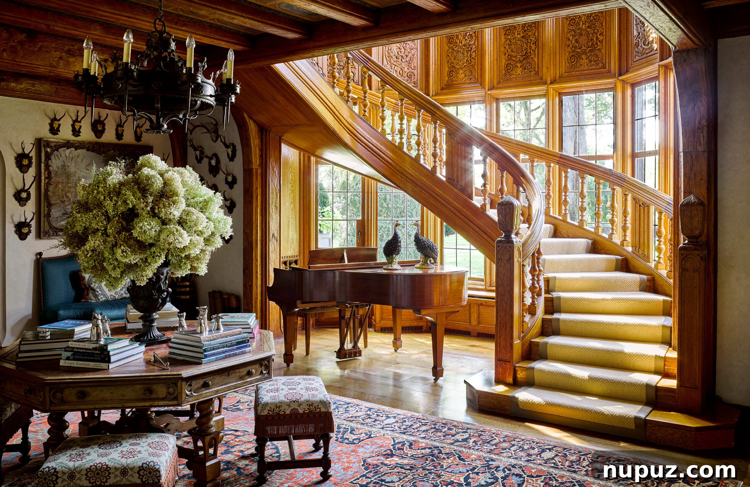 Designing Your Magnificent Life 7 A spacious and elegant living area, blending comfort with classic design elements and vibrant accents, characteristic of the luxurious interiors showcased in Tommy Hilfiger's homes.