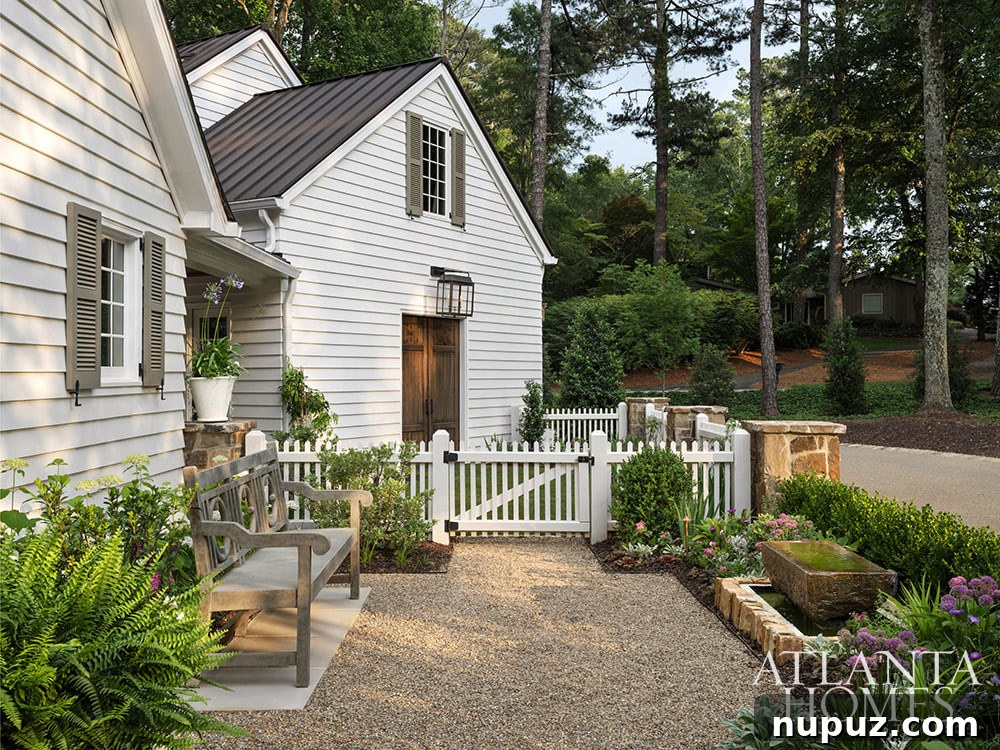 An elegant exterior view of the Atlanta home, highlighting its sophisticated architecture and integration with the surrounding landscape.