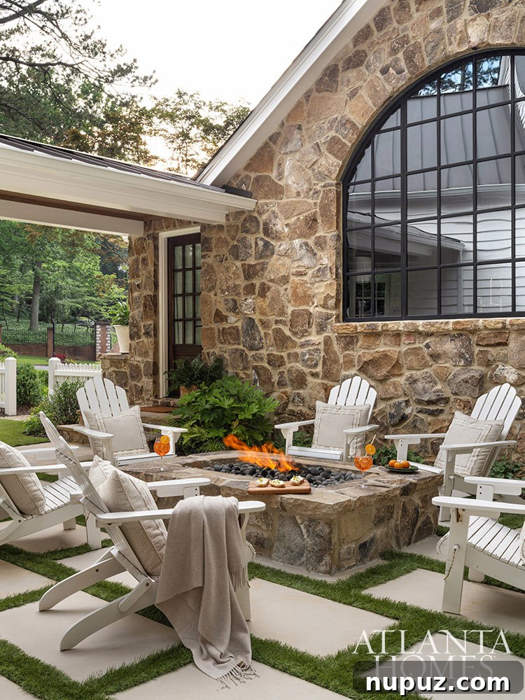 A charming outdoor fireplace area with comfortable chairs, perfect for enjoying cool evenings and creating a warm ambiance.