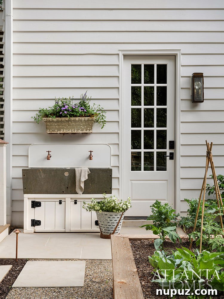 A close-up of lush, vibrant landscaping and architectural details of the home, showcasing the exquisite garden design.