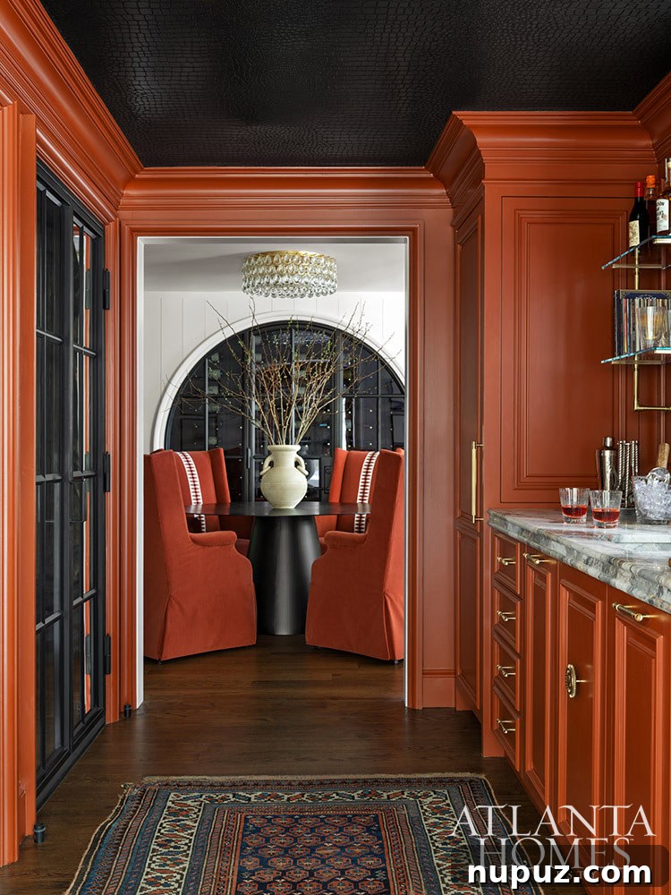 A cozy breakfast nook or casual dining area connected to the kitchen, featuring a round table and comfortable banquette seating for everyday meals.
